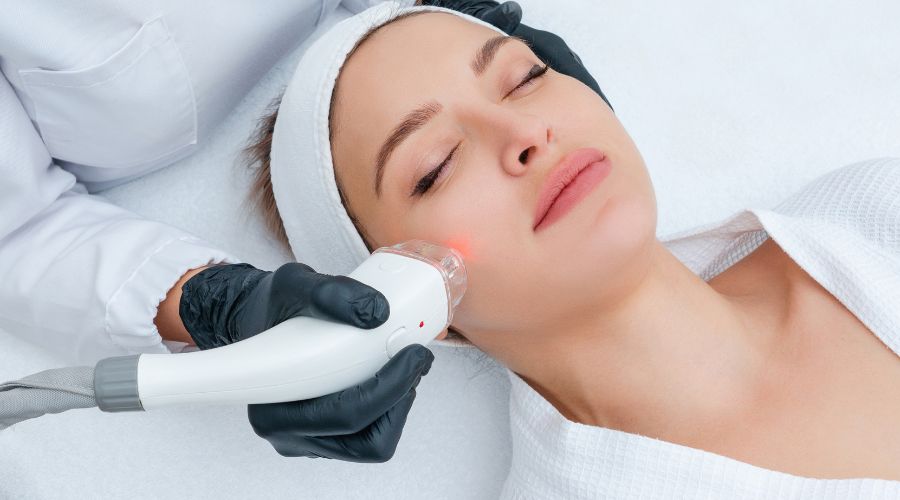 woman getting a face laser treatment