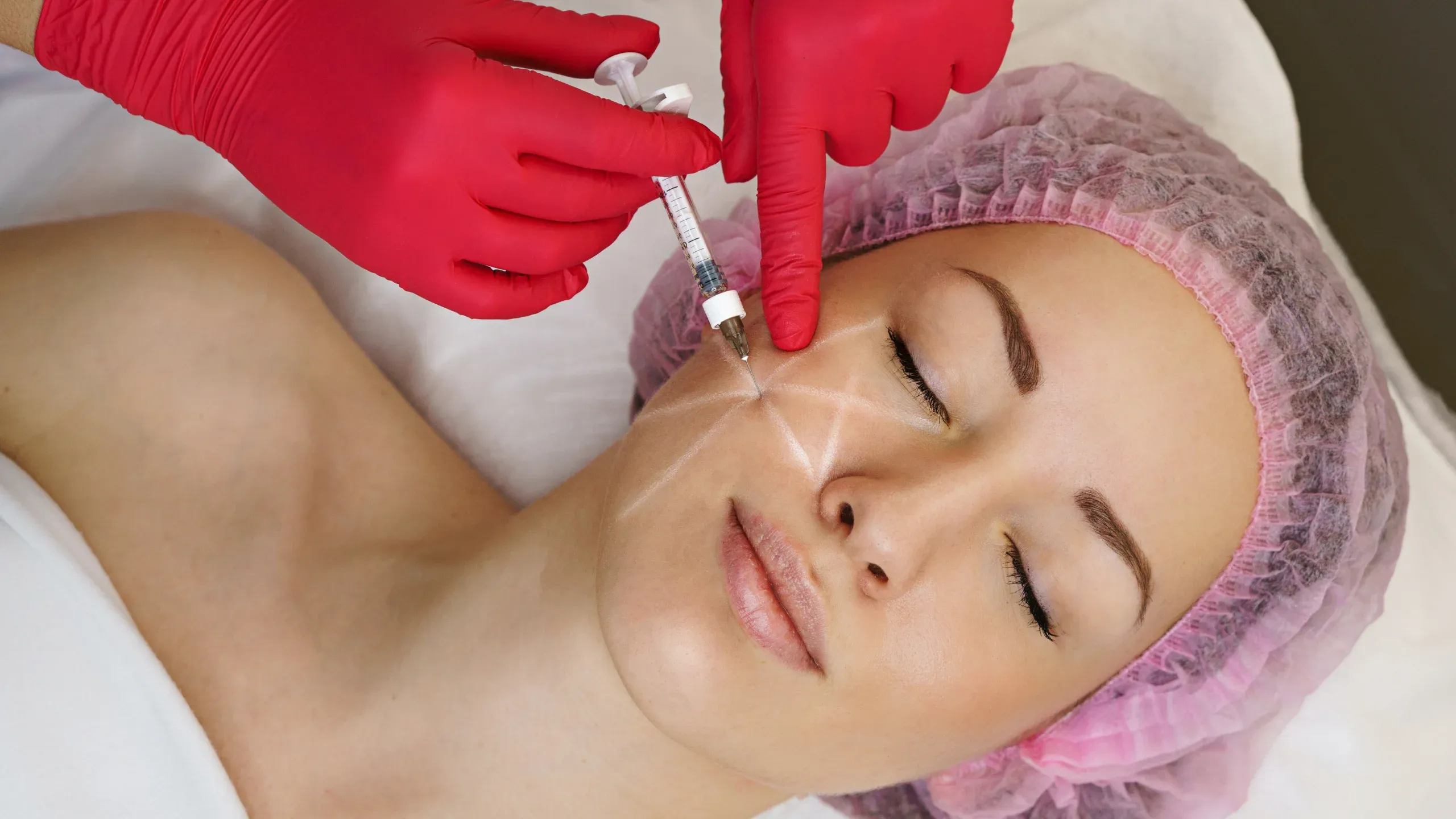 Application of hyaluronic acid on aging skin, demonstrating its hydrating and anti-aging benefits