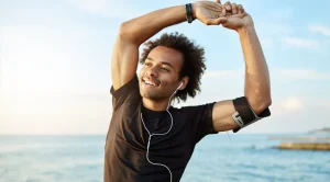 exercising guy stretching his arms